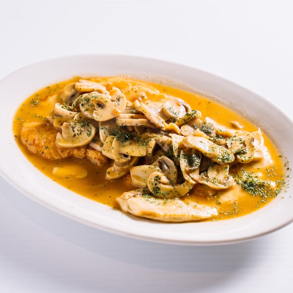 Sautéed chicken or veal with sliced mushrooms and parsley in a savory golden sauce.