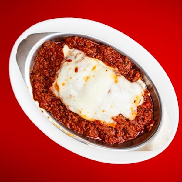 Hearty baked pasta dish with rich red sauce and melted white cheese.